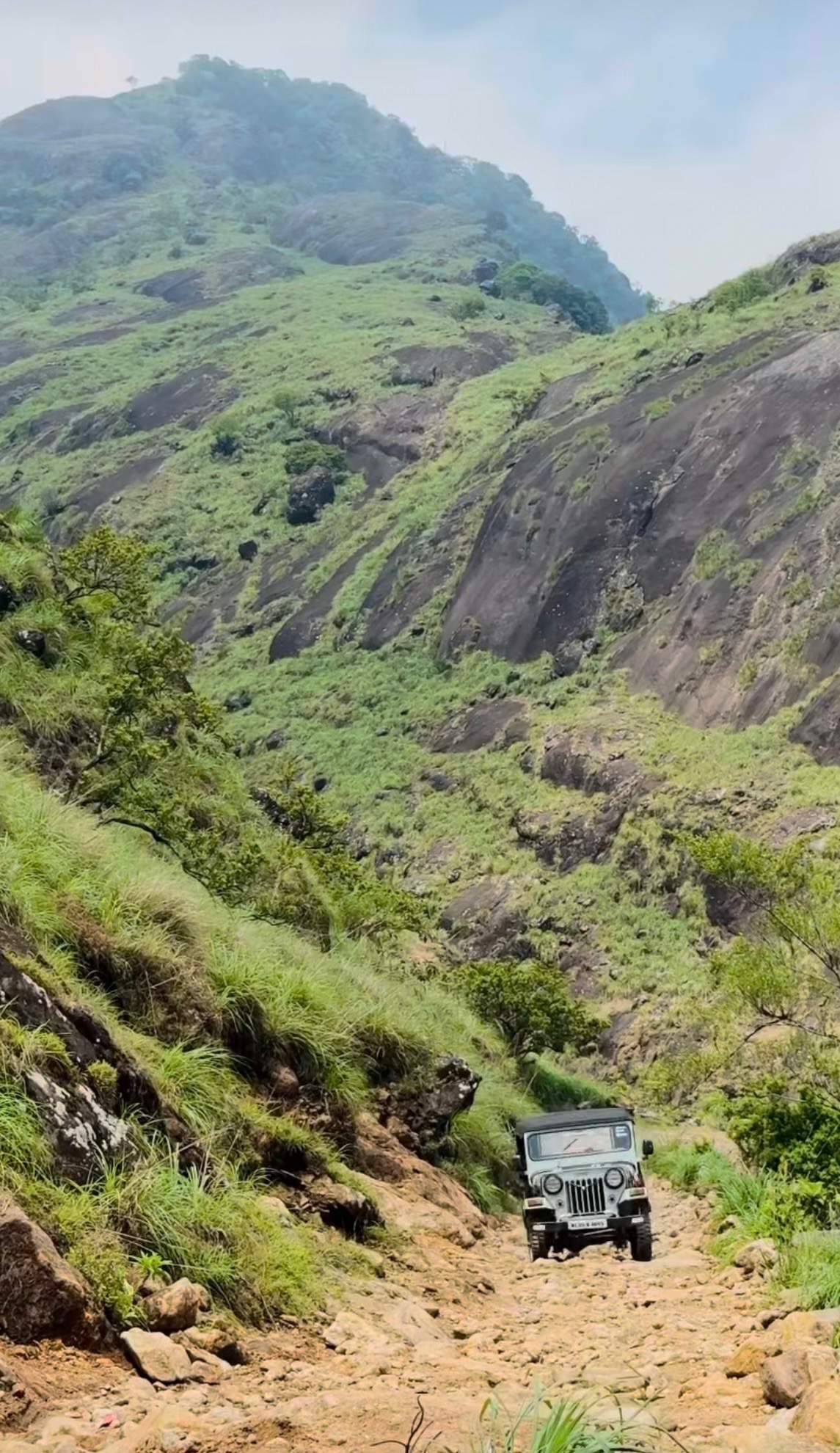The British Climb rocky road to Madammakulam Waterfall Basin Tourism Hill Station in Kerala